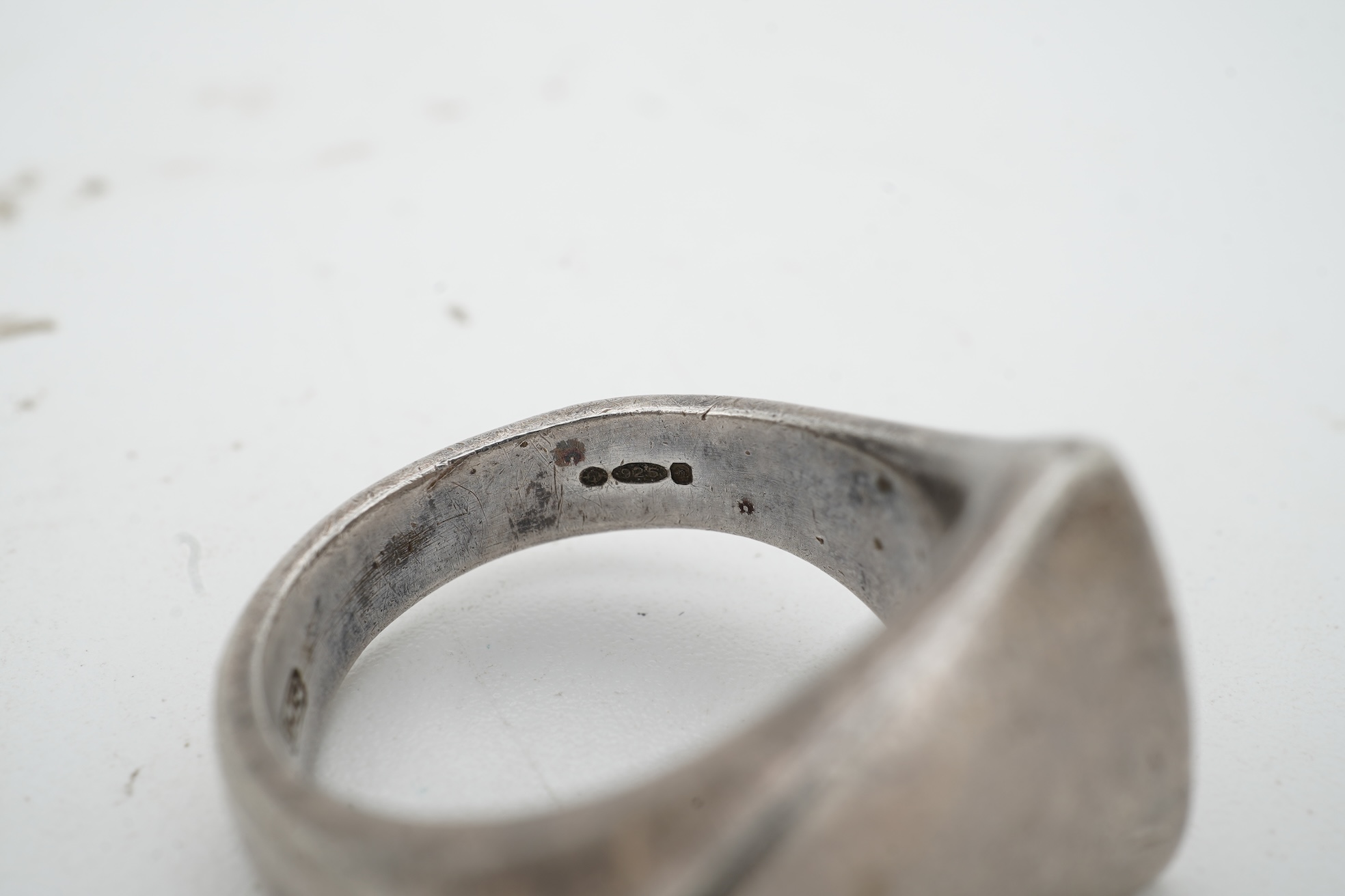 Nanna Ditzel for Georg Jensen, a silver bracelet, circa 1972, and a Georg Jensen ring, circa 1968, the bracelet composed of polished oval links with a concealed hoop clasp, length approximately 17cm, signed Georg Jensen,